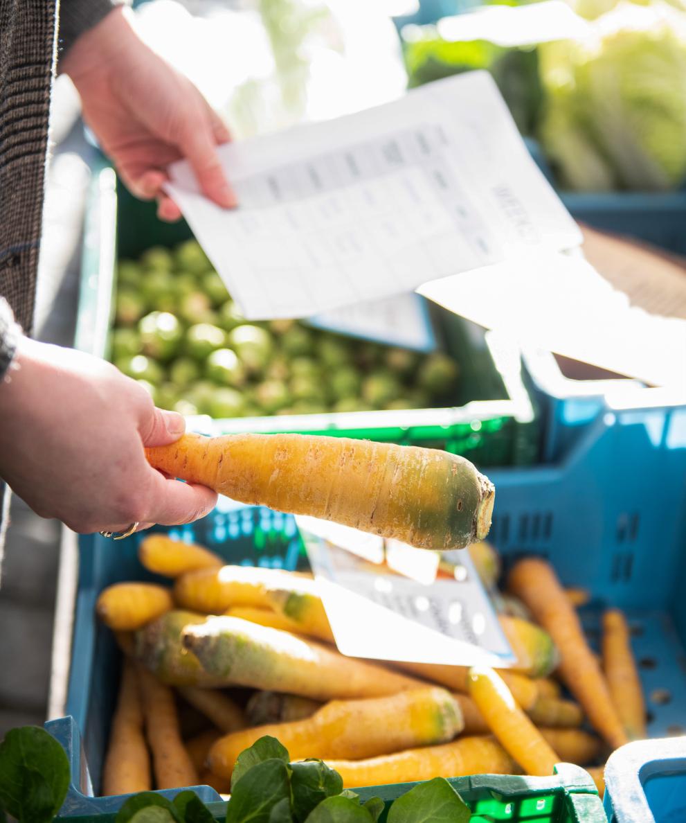 woman buying carrots